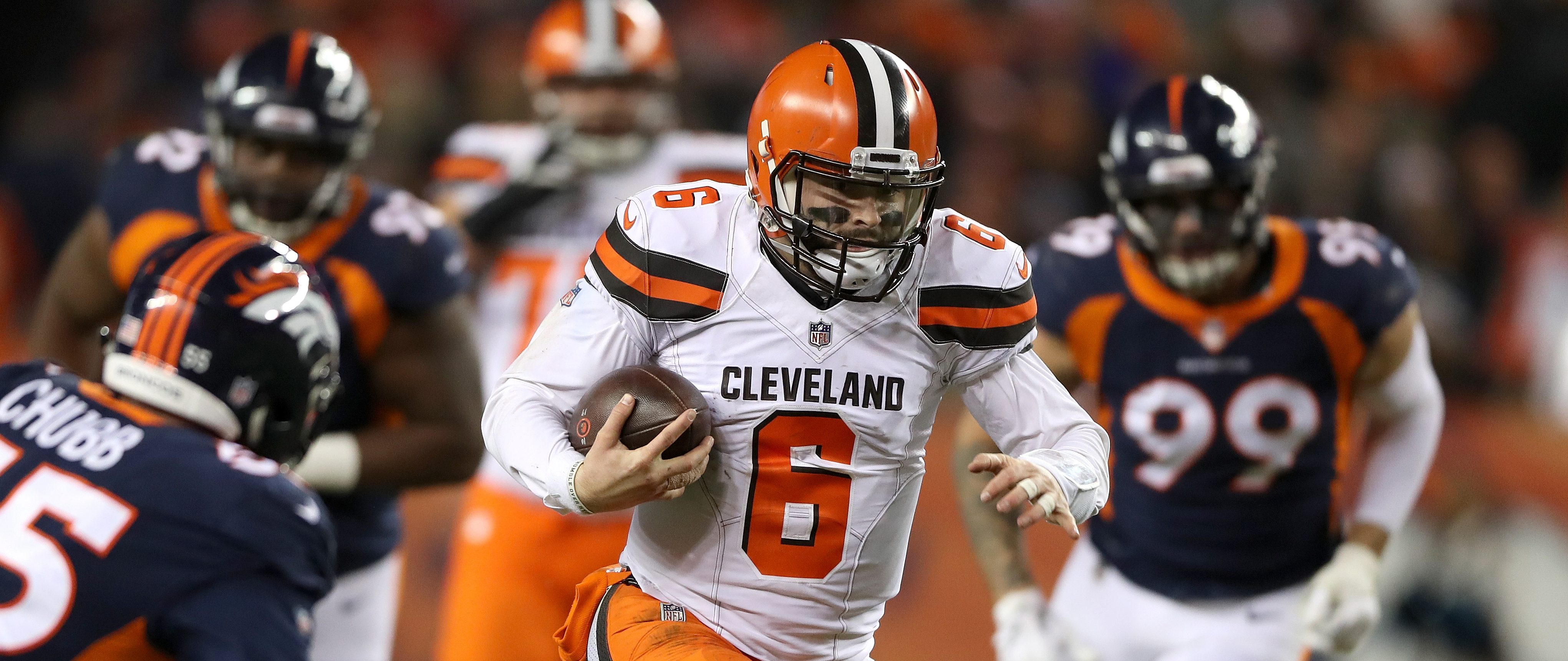 Quarterback Baker Mayfield #4 of the Cleveland Browns carries the ball against the Denver Broncos at Broncos Stadium at Mile High on December 15, 2018 in Denver, Colorado. (Photo by Matthew Stockman/Getty Images)