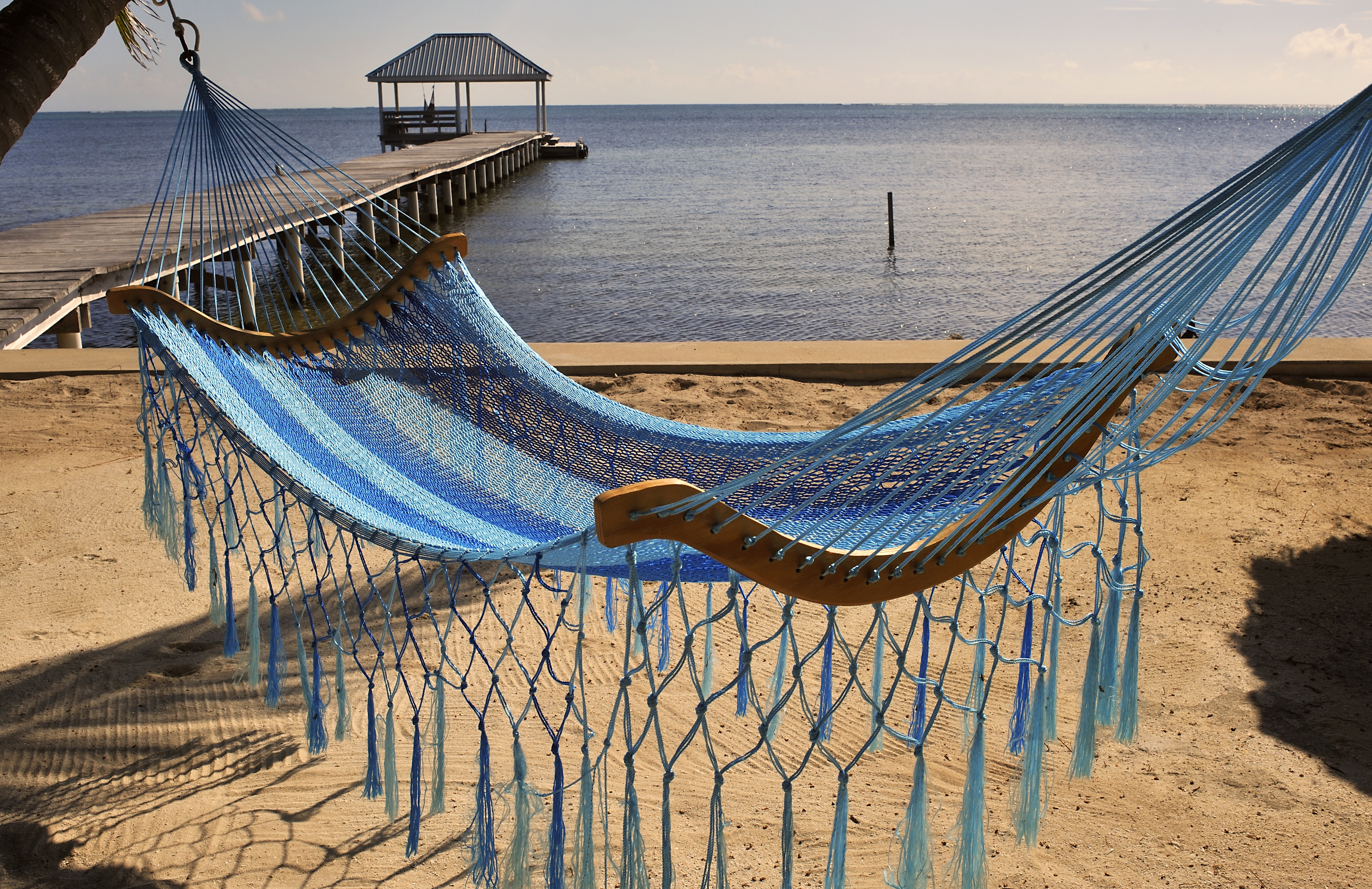 A view of a hammock on the beach on October 24, 2010 in the Island of Ambergris Caye, Belize, Central America.  hammock in carabbean islands, Ambergris Caye, Belize. (Photo by Philippe ROYER/Gamma-Rapho via Getty Images)