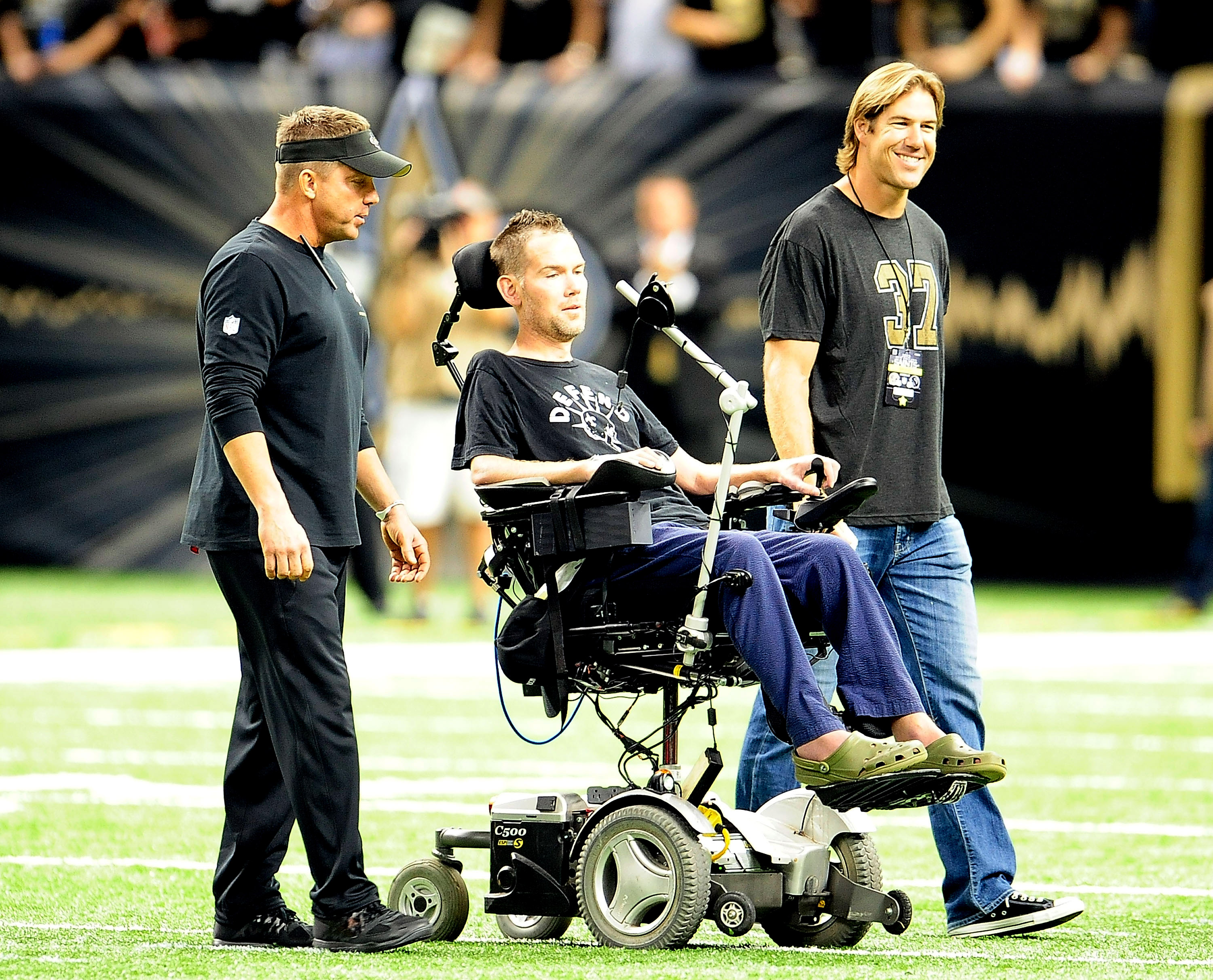NEW ORLEANS, LA - SEPTEMBER 08:  ( L to R ) Sean Payton, head coach of the New Orleans Saints, takes the field with former players Steve Gleason and Scott Fujita prior to a game against the Atlanta Falcons at the Mercedes-Benz Superdome on September 8, 2013 in New Orleans, Louisiana.  The Saints defeated the Atlanta Falcons 23-17.  (Photo by Stacy Revere/Getty Images)