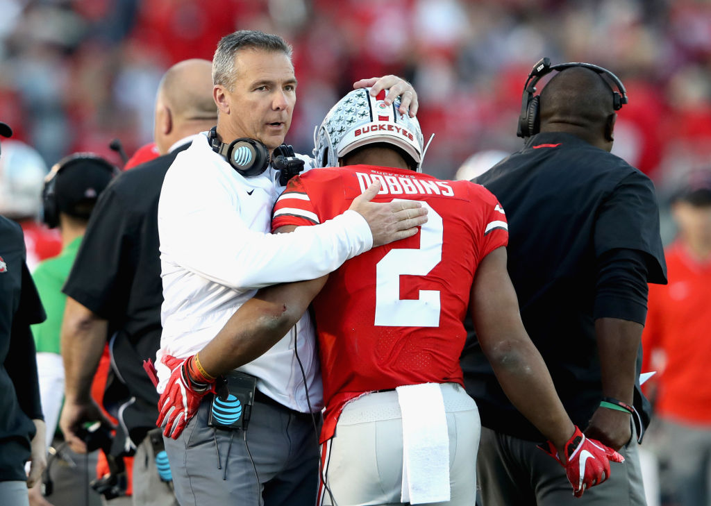 PASADENA, CA - JANUARY 01:  Ohio State Buckeyes head coach Urban Meyer and J.K. Dobbins #2 of the Ohio State Buckeyes celebrate a touchdown during the second half in the Rose Bowl Game presented by Northwestern Mutual at the Rose Bowl on January 1, 2019 in Pasadena, California.  (Photo by Sean M. Haffey/Getty Images)