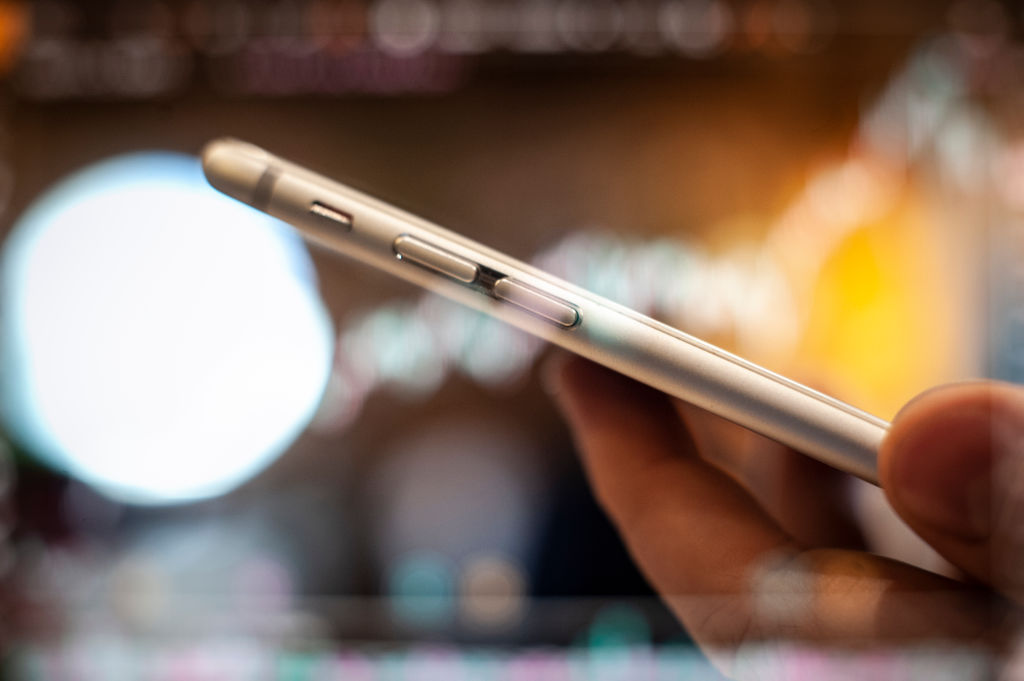 A stock market graph is seen in this in camera double exposure photo illustration with an iPhone on September 24, 2018. (Photo by Jaap Arriens/NurPhoto via Getty Images)