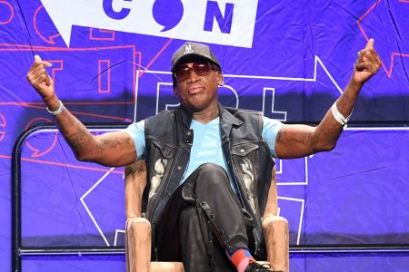 Basketball star Dennis Rodman (R) addresses the crowd on North Korea during the "Slam Dunk Diplomacy with Dennis Rodman" panel at the 2018 Politicon in Los Angeles, California on October 20, 2018. - The two day event covers all things political with dozens of high profile political figures. (Photo by Mark RALSTON / AFP)        (Photo credit should read MARK RALSTON/AFP/Getty Images)