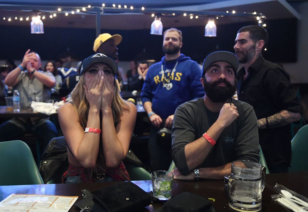 Los Angeles Rams fans react after their team was defeated 13-3 by the New England Patriots during the Super Bowl LIII in Los Angeles on February 3, 2019. (Photo by Mark RALSTON / AFP/Getty Images)