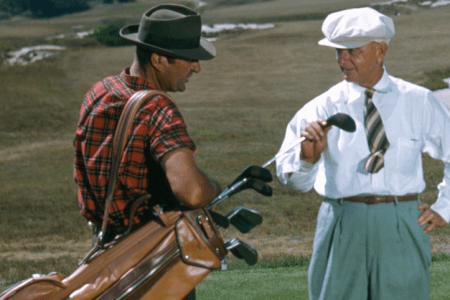 SOUTHAMPTON NY - 1950: A golfer and his caddy prepare to tee off at the National Golf Links of America Southampton New York in 1950. This photo was shot for the story 'America's Snootiest Golf Course' published in the April 22 1950 issue of the Saturday Evening Post. (Ivan Dmitri/Photo by Michael Ochs Archive/Getty Images)