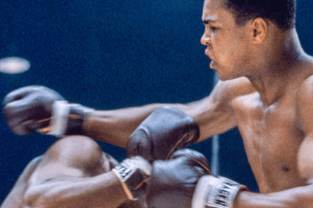 MIAMI BEACH, FL - FEBRUARY 25: Sonny Liston (left) dodges a right hook by Cassius Clay during their bout at the Convention Center in Miami Beach, Florida, February 25, 1964. Cassius Clay won the World Heavyweight Title by RTD in round 6 of 15. (Photo by Stanley Weston/Getty Images)
