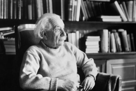 Princeton, New Jersey: Physicist Albert Einstein (1879-1955), seated in book-filled office. (Getty Images)