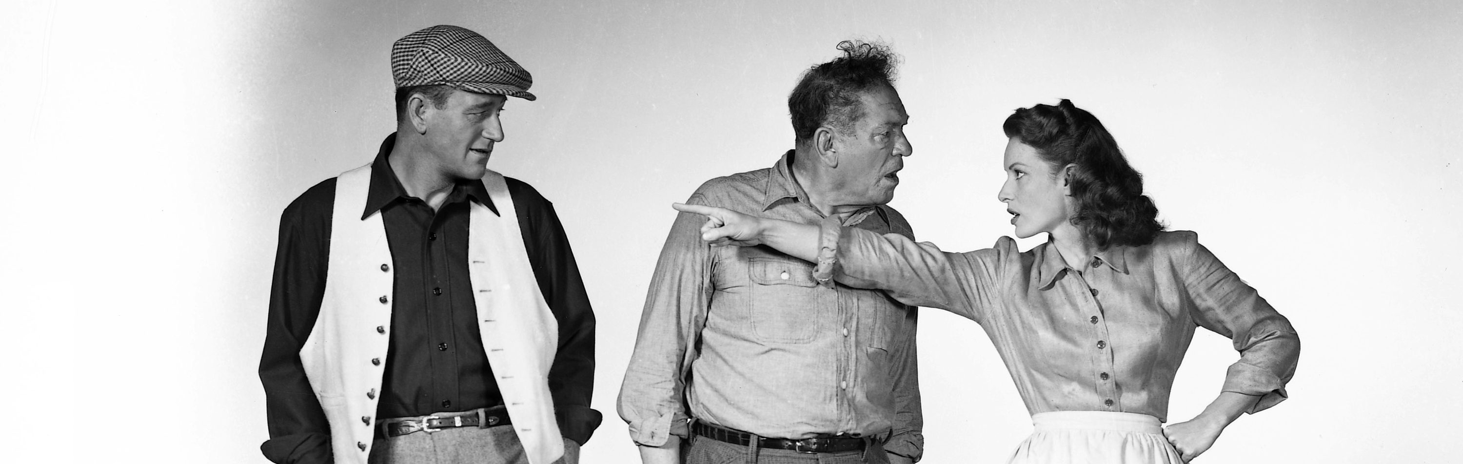 From left to right, actors John Wayne (1907 - 1979) as Sean Thornton, Victor McLaglen (1886 - 1959) as Squire 'Red' Will Danaher and Maureen O'Hara (1920 - 2015) as Mary Kate Danaher in a publicity still for the film 'The Quiet Man', 1952.  (Photo by Silver Screen Collection/Getty Images)