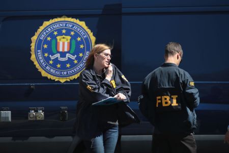 SUNSET VALLEY, TX - MARCH 20:  FBI agents collect evidence at a FedEx Office facility following an explosion at a nearby sorting center on March 20, 2018 in Sunset Valley, Texas. A package, reported to have been shipped from this store, exploded while being transported on a conveyor shortly after midnight this morning at the sorting facility in Schertz, Texas causing minor injuries to one person. The explosion is believed to be related to several recent package bombs that have been detonated in Austin, Texas.  (Photo by Scott Olson/Getty Images)