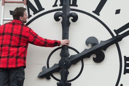 Picture taken on March 23, 2018 shows a technician working on the clock of the Lukaskirche Church in Dresden, eastern Germany. (SEBASTIAN KAHNERT/AFP/Getty Images)