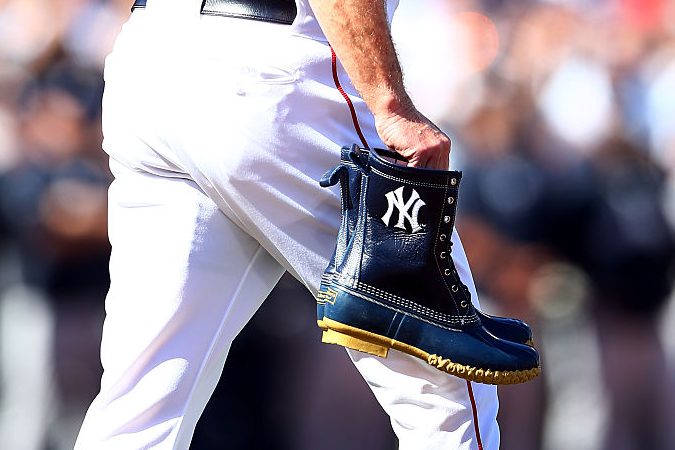 Brian Butterfield brings a pair of custom L.L. Bean boots to Derek Jeter. (Elsa/Getty)