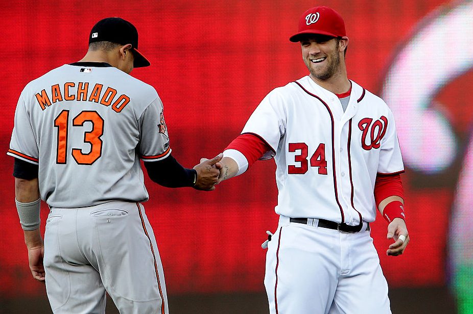 Bryce Harper (34) greets Manny Machado (13). (Tony Quinn/Icon SMI/Corbis via Getty)