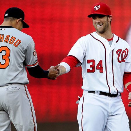 Bryce Harper (34) greets Manny Machado (13). (Tony Quinn/Icon SMI/Corbis via Getty)