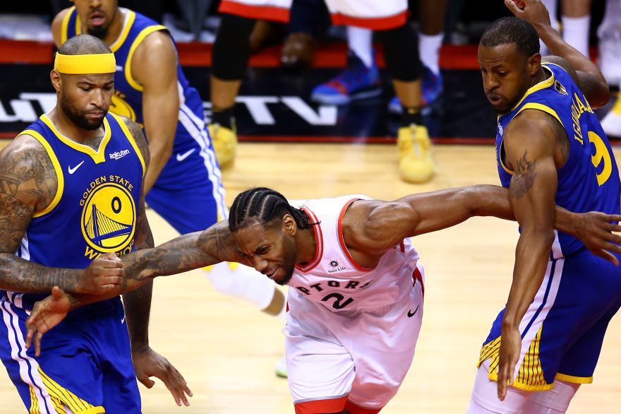 Kawhi Leonard defended by DeMarcus Cousins and Andre Iguodala. (Vaughn Ridley/Getty)