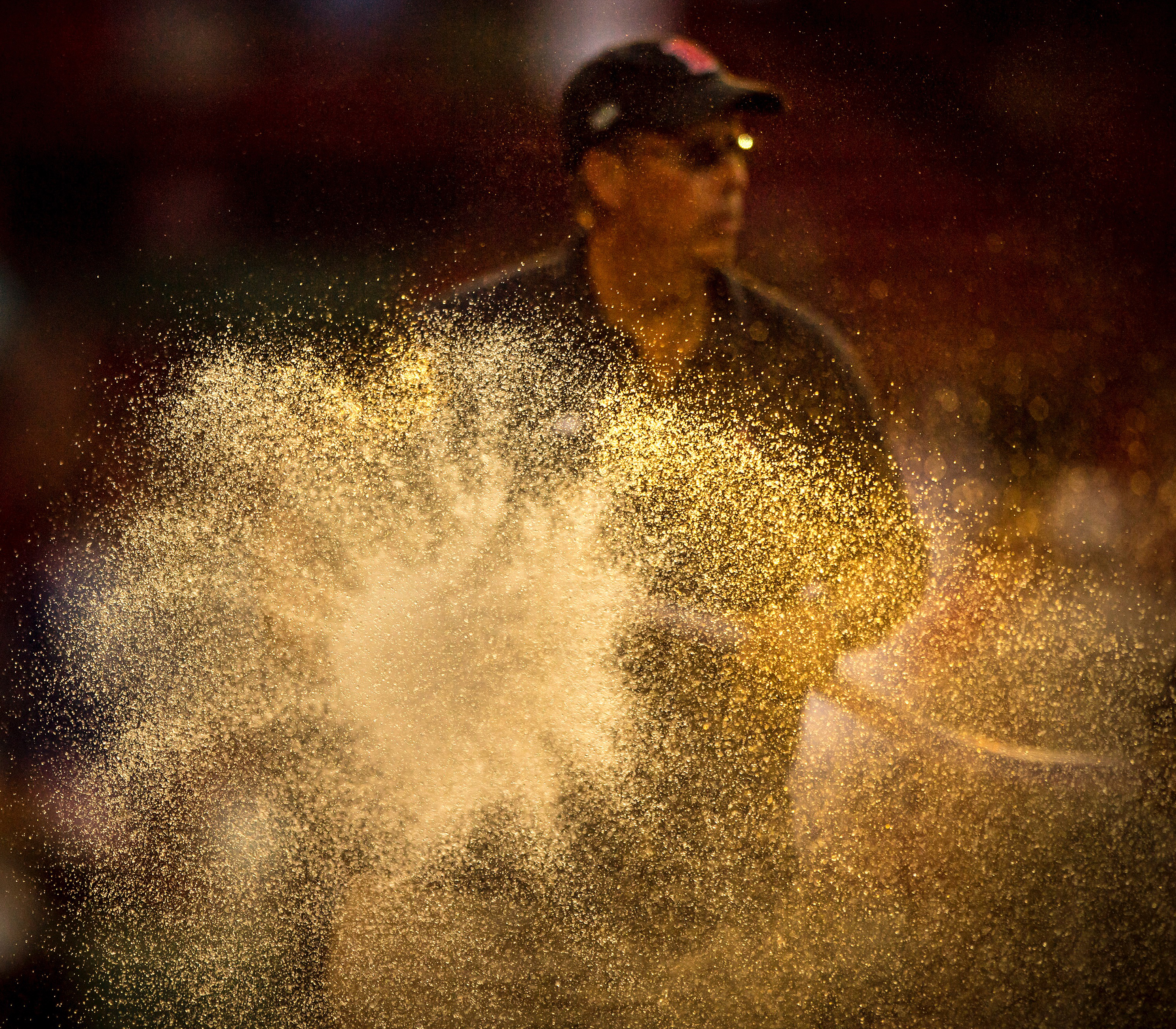 Dave Mellor sprays the hose at Fenway Park. (Billie Weiss/Boston Red Sox/Getty)