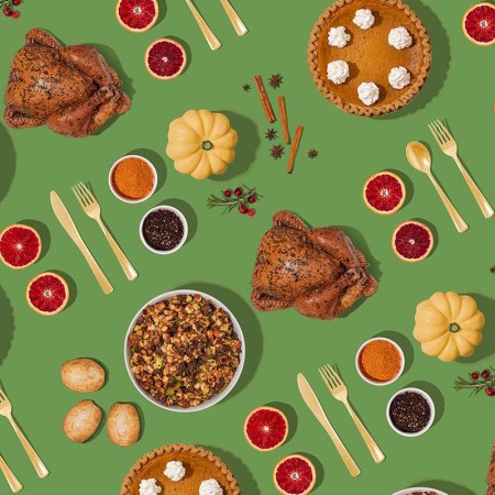 A Thanksgiving feast on a green background.