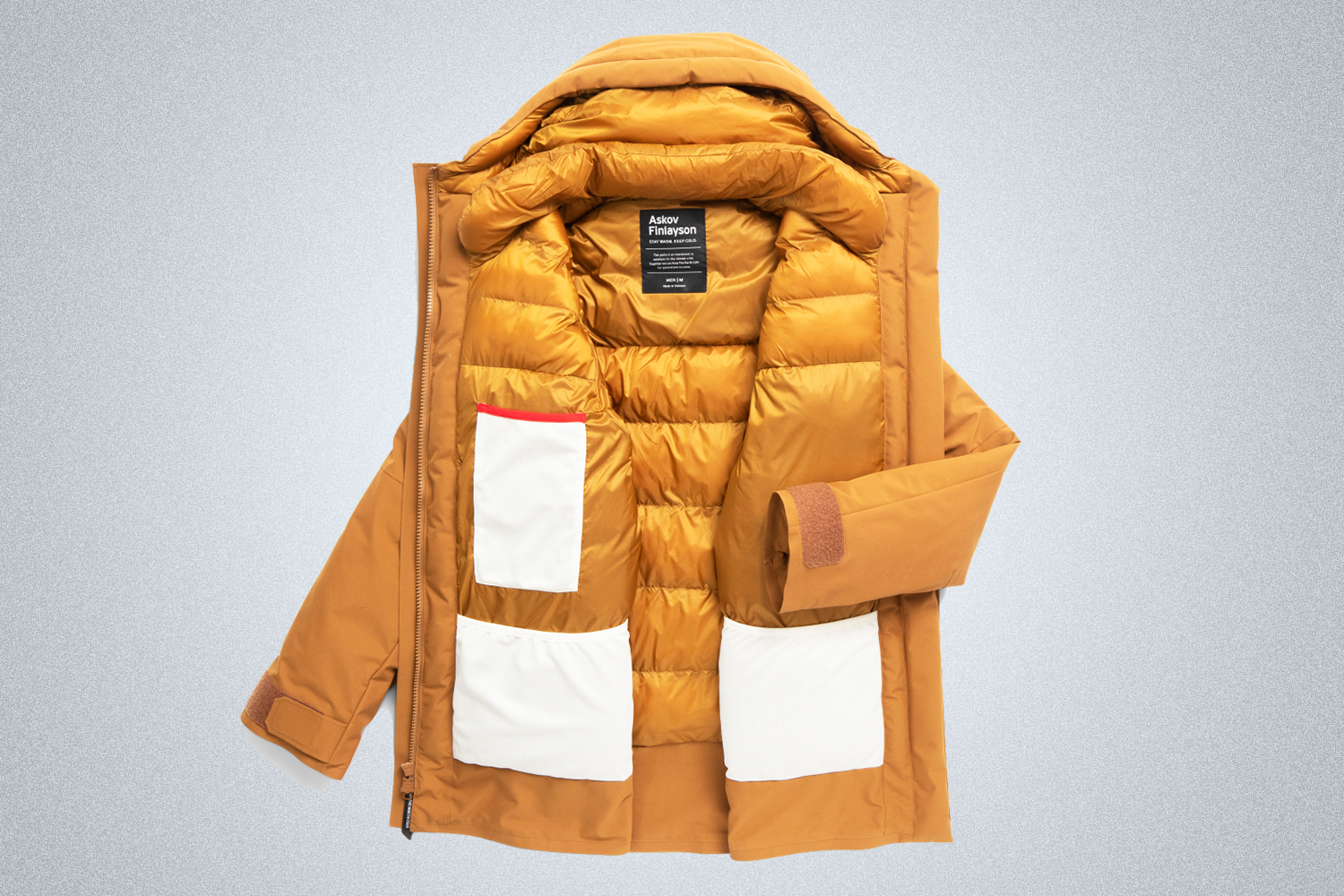 The Men's Winter Parka from Askov Finlayson in Bear Brown. In this photo the coat is open showing the interior pockets.