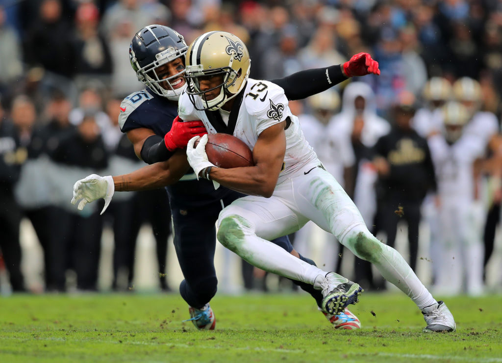 Wide receiver Michael Thomas of the New Orleans Saints makes a pass reception as cornerback Logan Ryan of the Tennessee Titans tackles during the third quarter in the game at Nissan Stadium on December 22, 2019 in Nashville, Tennessee. (Photo by Brett Carlsen/Getty Images)