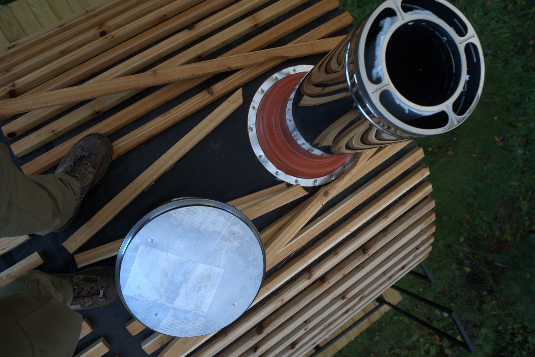 <strong>Fitting the Stove</strong><br>“The stove was made by a Finnish company called <a href="https://harvia.fi/en/">Harvia</a>. It's heavy — maybe 400 to 500 lbs. You have to source<strong> </strong>a stove that has a heat output rating that corresponds with the size of the sauna based on the cubic feet of space. It's a balance between getting something that can heat it quickly but not giving up all your space to a stove. If you're using an electric, you just drop the stove and run the wire out. With this one, the stove pipe is not attached, so you have cut an eight-inch hole in the ceiling of a perfectly finished roof. You put the pipe through then put insulation around the baffle and cap the top of it with a spark arrestor. That way, if there's any unburned wood, it doesn't jump out and start a forest fire.”