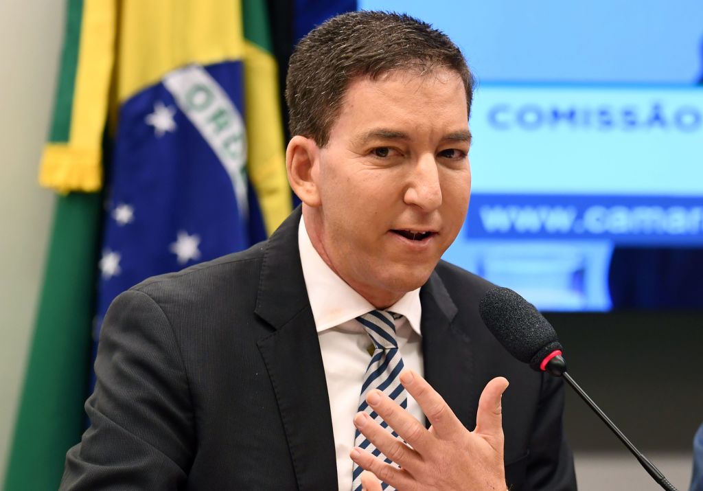 US journalist Glenn Greenwald, founder and editor of The Intercept website gestures during a hearing at the Lower House's Human Rights Commission in Brasilia, Brazil, on June 25, 2019.  (Photo by EVARISTO SA / AFP)