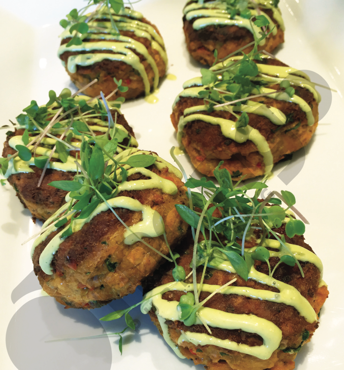 <strong>Caribbean Salmon Croquettes</strong><br>“My mother makes these and my father and I would fight over them. They're better once they have cooled off, the flavors really come together,” Ingraham says. “My mother normally makes them with just onions and some garlic and a little celery seasoning or whatever. But of course, I want to take it to another level, so I went a little more Caribbean with it and added cilantro, a little Creole seasoning and then smoked paprika with dijon mustard. And I even have a little asiago cheese as well. They're very flavorful, nice and crispy on the outside ... Then we add cilantro aioli on the top of them. It's something quick and it's something that definitely would not be expected at a Super Bowl party.” 