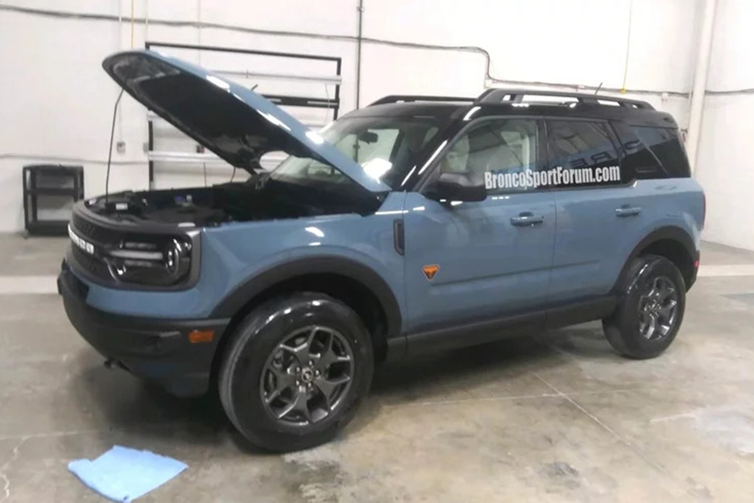 Leaked blue Ford SUV in a garage