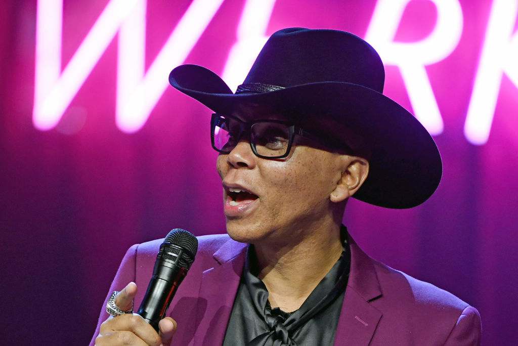 Drag queen RuPaul holding a microphone