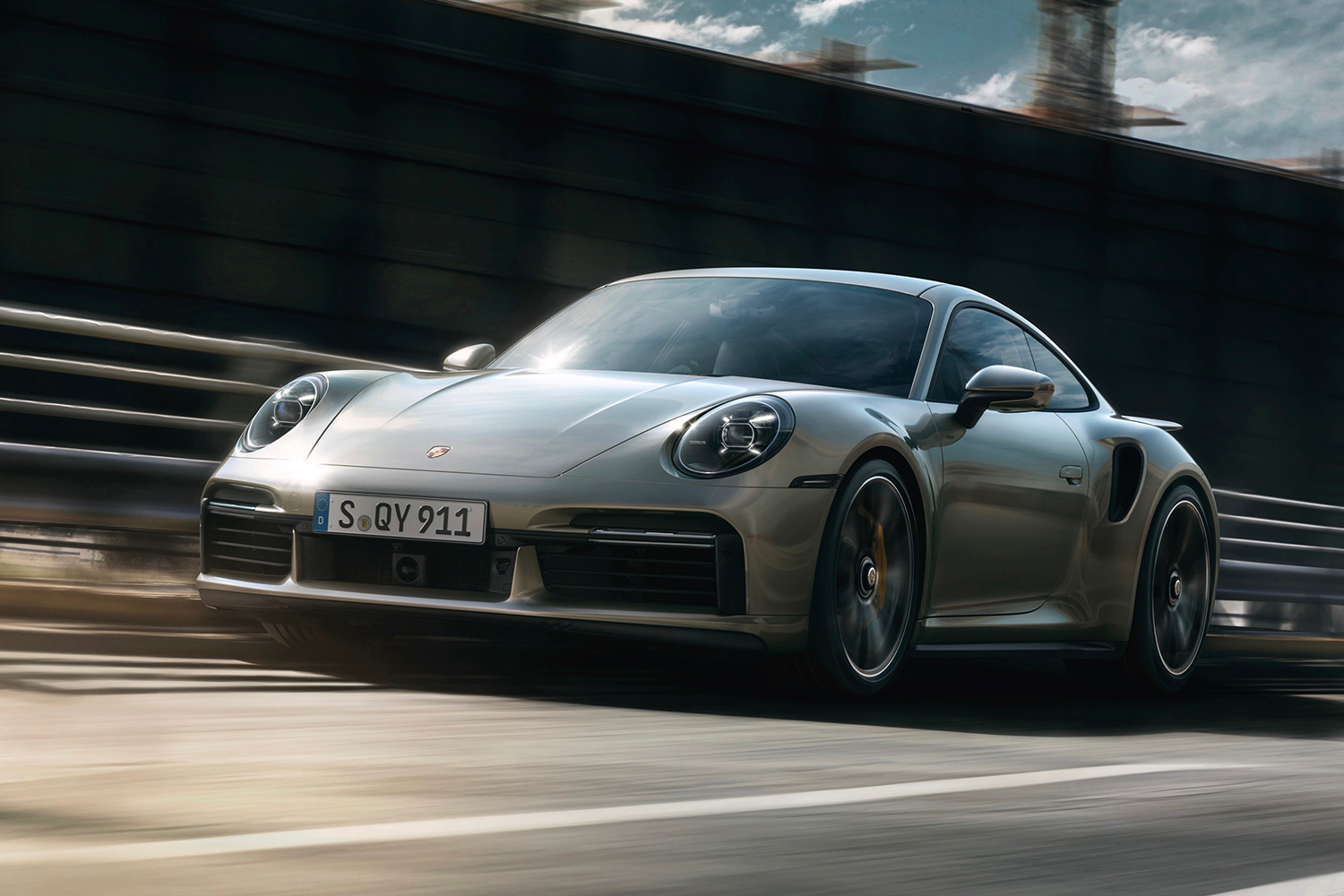 Porsche coupe driving on the highway