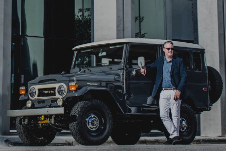 Menswear designer Todd Snyder next to an SUV