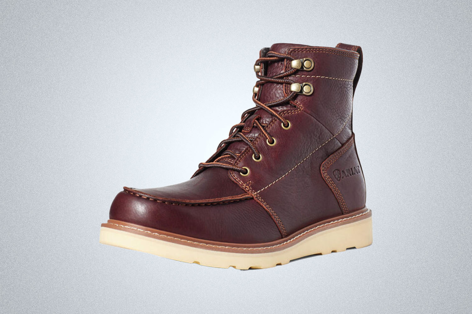 a leather Ariat work boot on a grey background