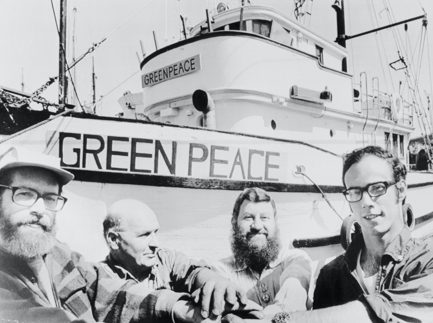 Men Seated near Greenpeace Vessel