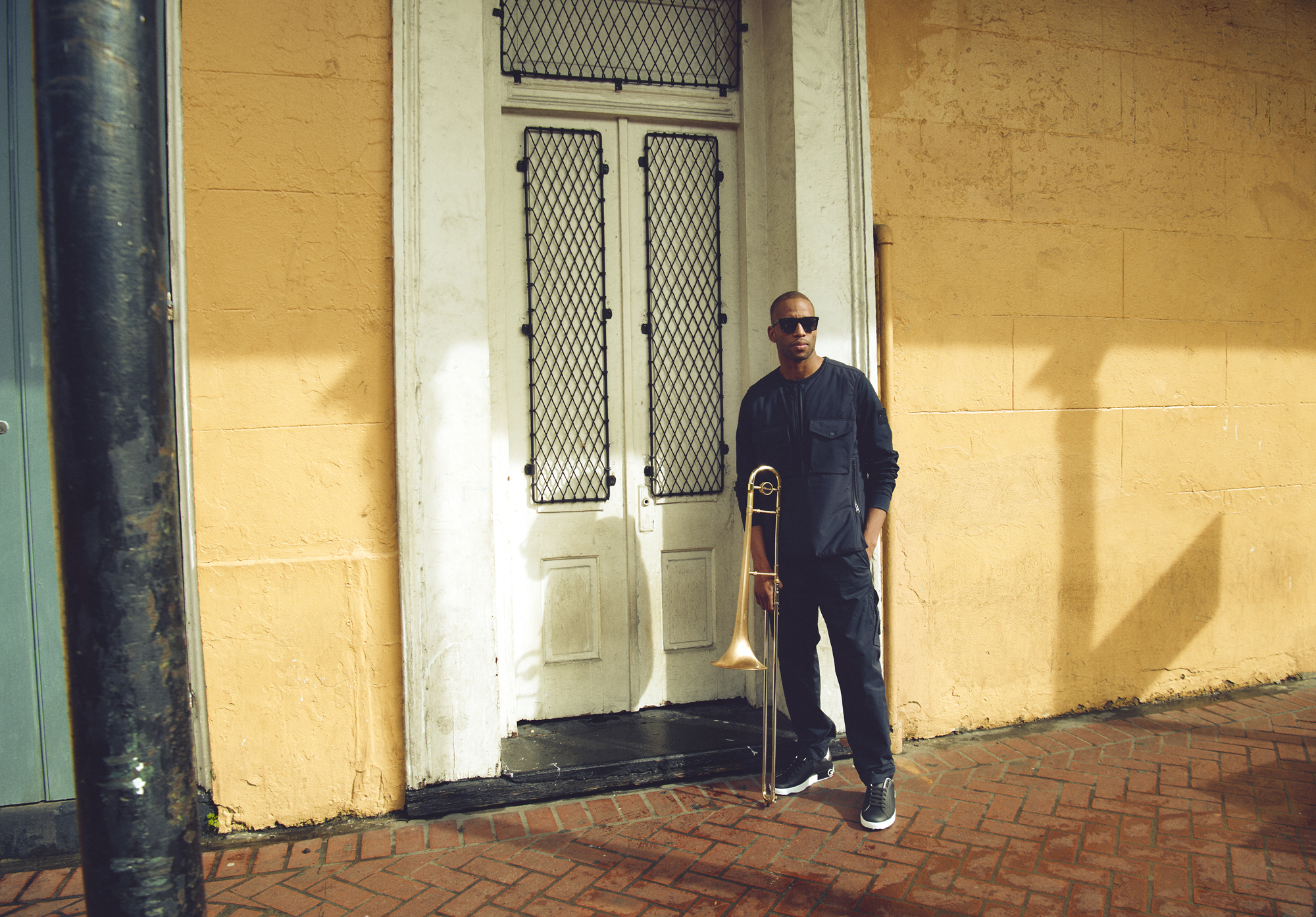Trombone Shorty wearing David Beckham Sun and Stone Island in the French Quarter