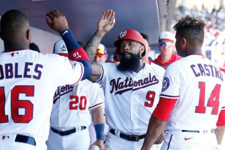 Eric Thames of the Washington Nationals celebrates with his teammates. (Michael Reaves/Getty)
