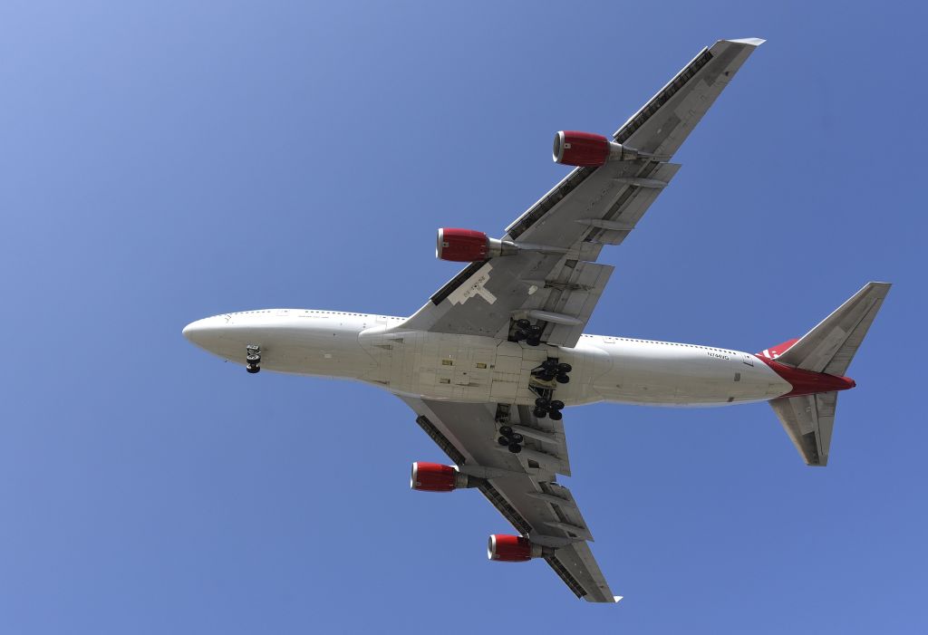 A Virgin Orbit 747-400 aircraft named 'Cosmic Girl' on final approach to Long Beach (CA) Airport, home of Sir Richard Branson's Virgin Orbit company, July 31, 2017 in Long Beach, CA.(Photo by Bob Riha, Jr.,/Getty Images)