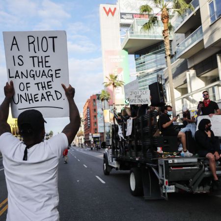 A man protests police brutality in Los Angeles