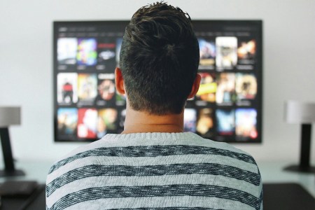 The back of a person's head watching Netflix