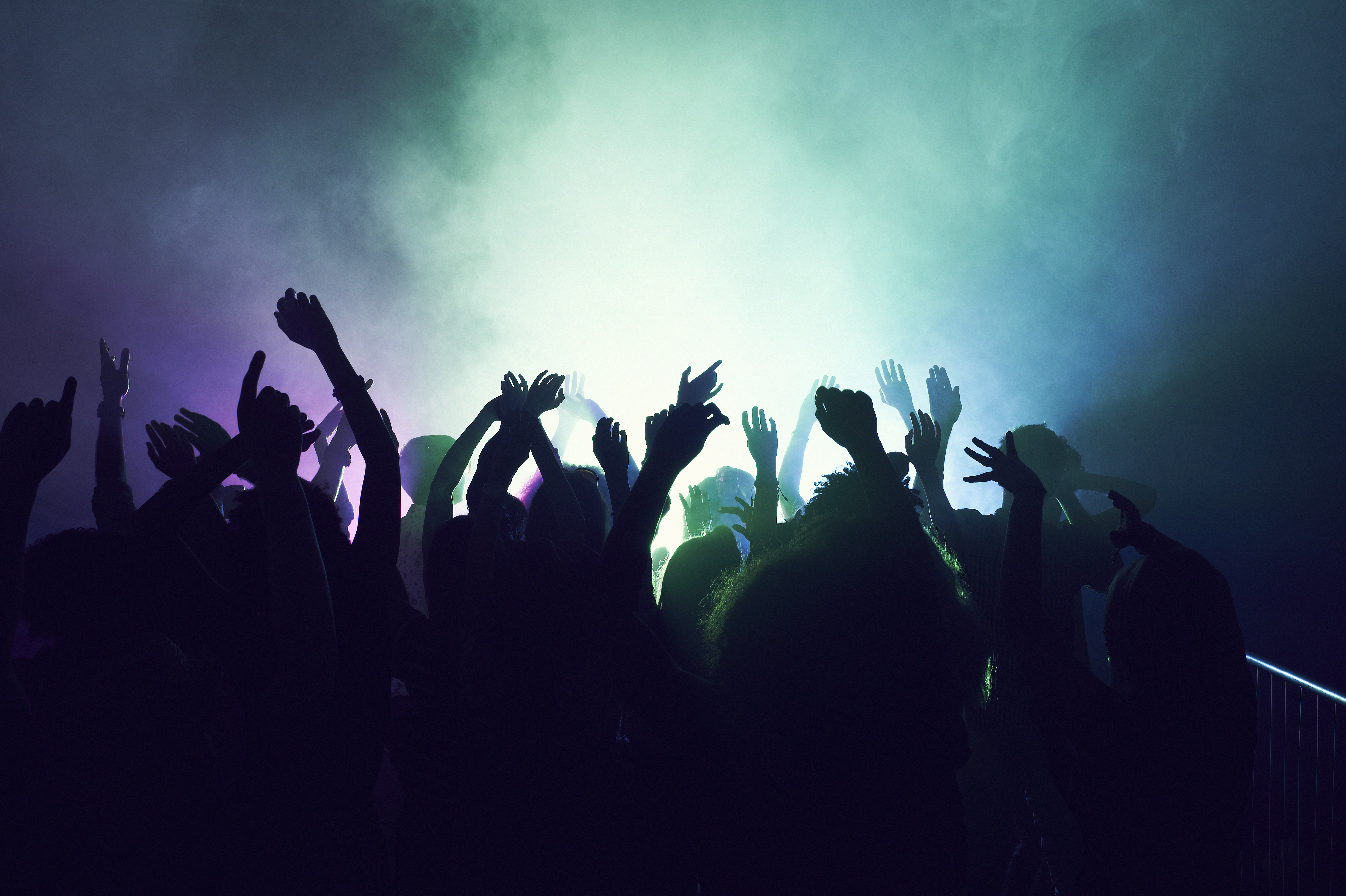 Crowd of people dancing at a rave