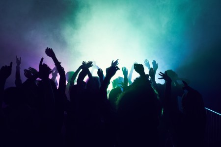 Crowd of people dancing at a rave