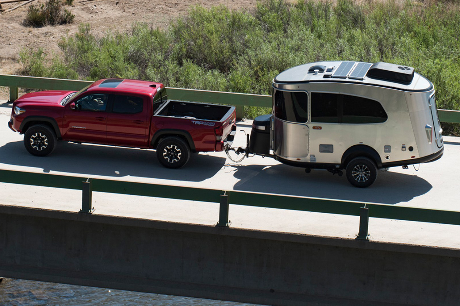 Airstream Basecamp trailer being towed behind a pickup truck