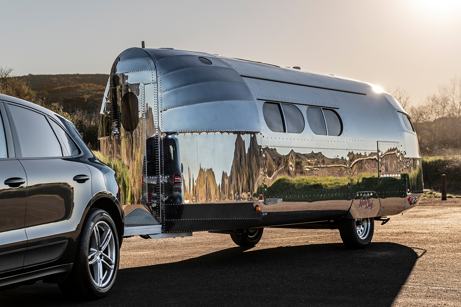 Bowlus Road Chief aluminum trailer being pulled by an SUV