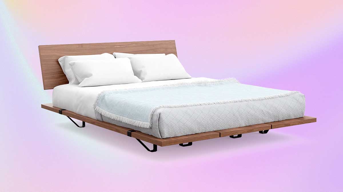 The Bed Frame from DTC furniture brand Floyd on a pink/purple background