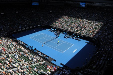 Spectators watch South Korea's Chung Hyeon play Tennys Sandgren of the US during their men's singles quarter-finals match on day 10 of the Australian Open tennis tournament in Melbourne on January 24, 2018.