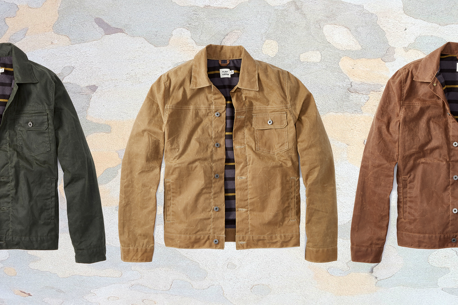 Three different colors of Flint and Tinder's men's flannel-lined waxed trucker jacket