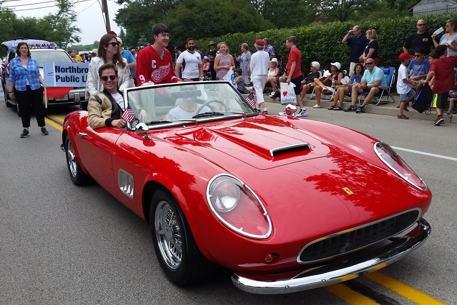 1961 Ferrari 250 GT California replica with people dressed like Ferris Bueller's Day Off characters