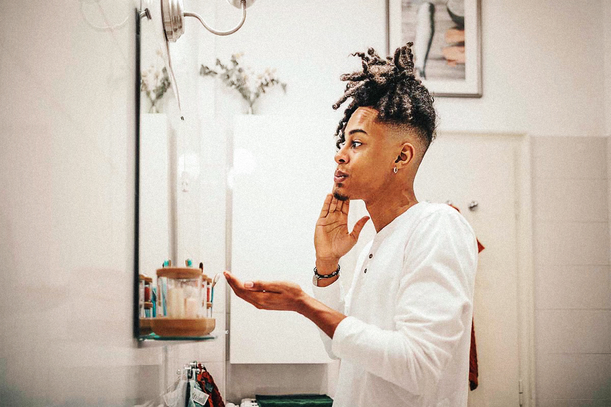 A man with lotion on his face.