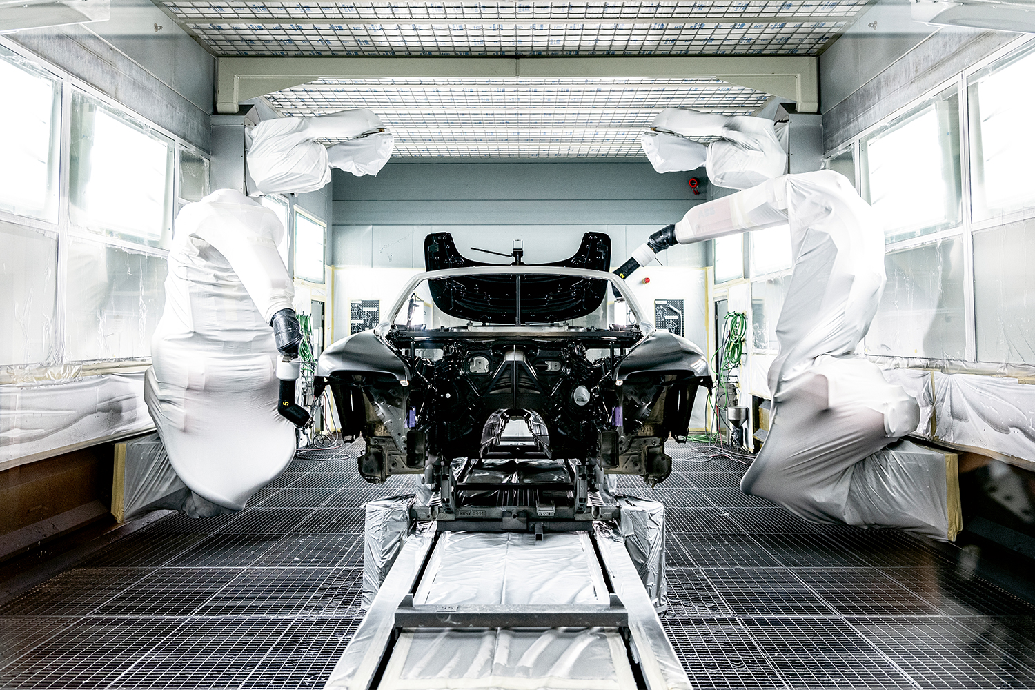 <strong>Paint Shop</strong><br><strong>“</strong>As I learned more about the bespoke car-building process, I wasn't surprised that Rolls-Royce offered paint matching, or will send out potential colors to the locations where the cars will be driven, so clients can see how they work in the light before fully committing. However, I was shocked by how a vehicle can receive around 30 layers of paint while not exceeding half-a-millimeter in thickness, and that if anything is found in the paint, such as an eyelash, the process has to start again.” — Simon Van Booy
