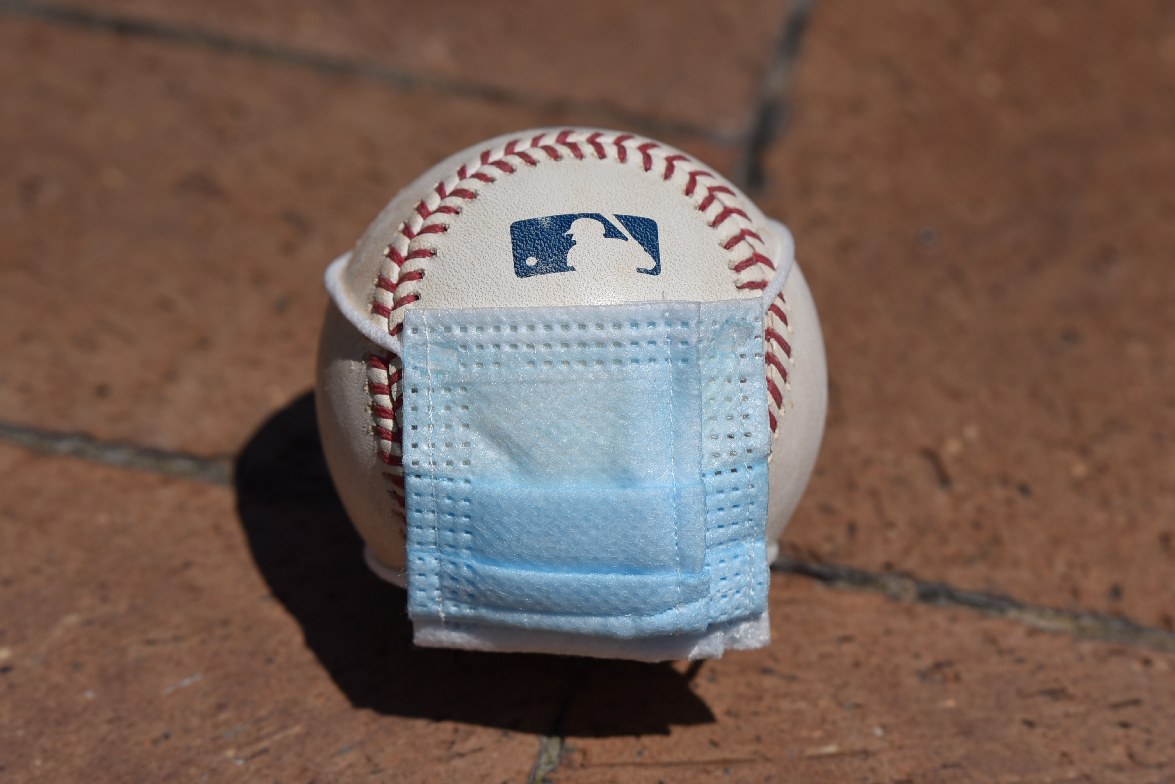 MLB baseball with a COVID mask