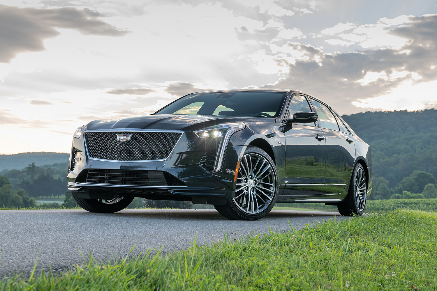 A Cadillac CT6-V sitting on the road between grass