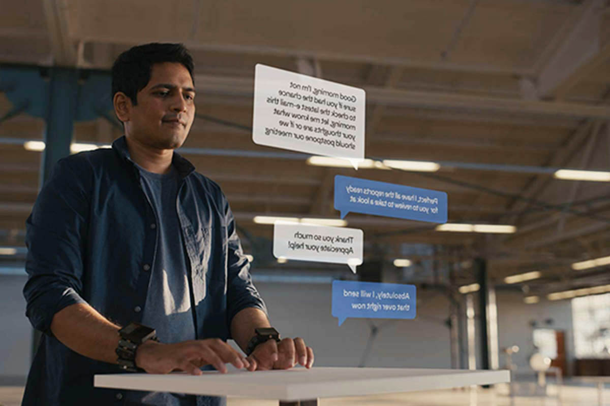 A man "virtual typing" using wristbands, sensors and AI