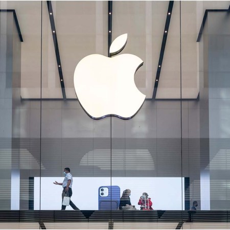 Customers are seen at the American multinational technology company Apple store in Hong Kong
