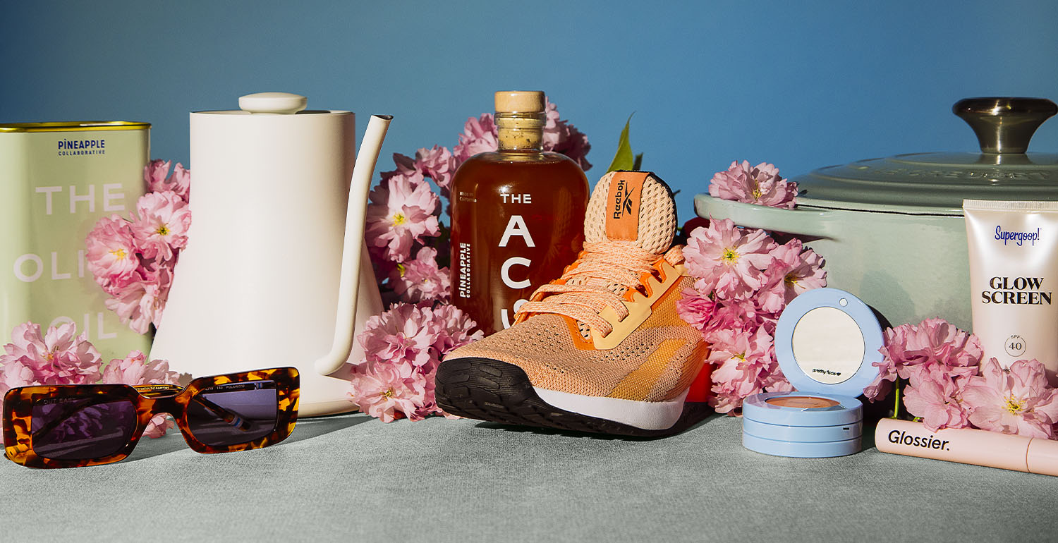 Mothers Day Gifts, clothing, cookware, beauty products laid out on a table